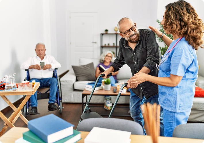 middle-age-doctor-woman-supporting-retired-man-walk-using-walker-nursing-home