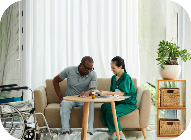 social-worker-checking-blood-pressure-patient-with-disability